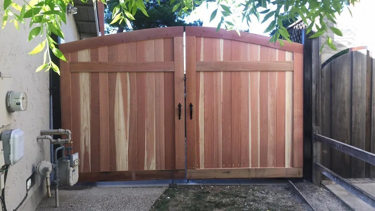 Arched double wood gate built by Meza's Fence