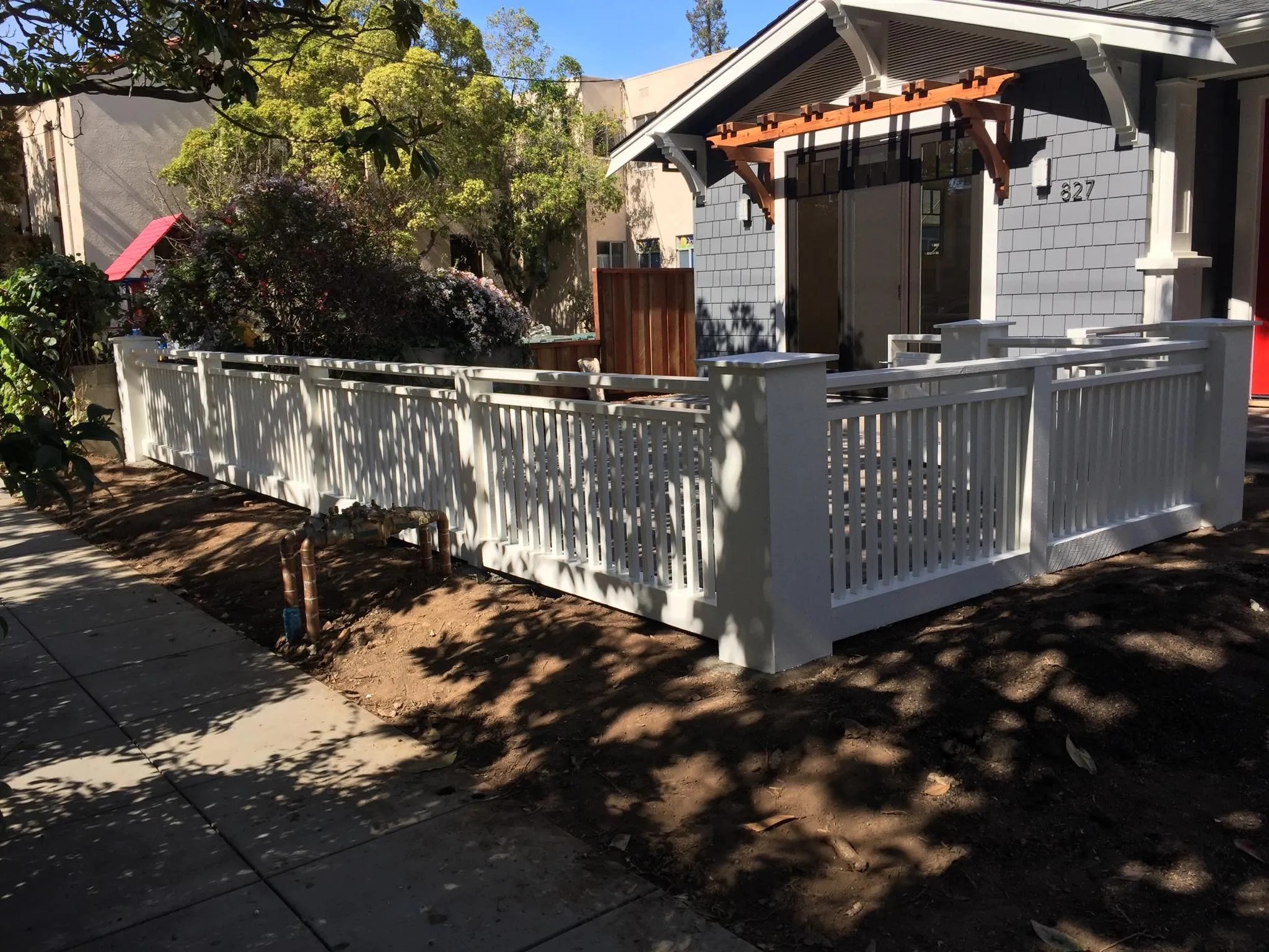 Custom white front entry fence by Meza's Fence