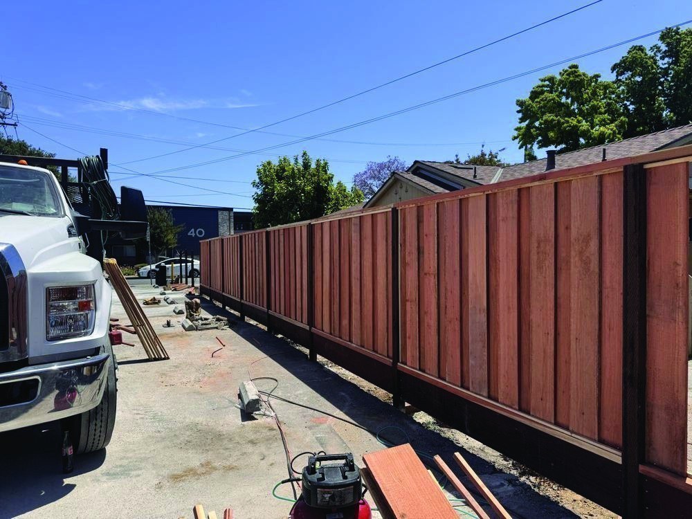 Stained redwood privacy fence by Meza's Fence