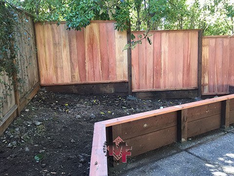 Capped retaining wall built by Meza's Fence